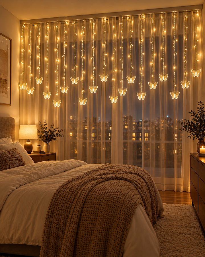 Butterfly curtain lights glowing warm white across a bedroom window