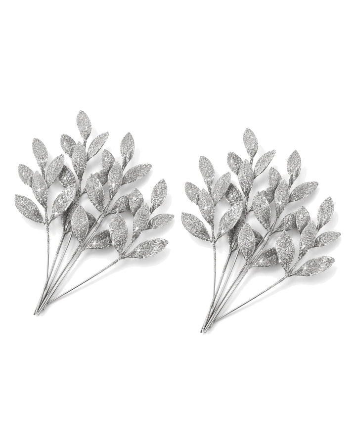Two sets of silver glitter leaf picks side by side on a white background