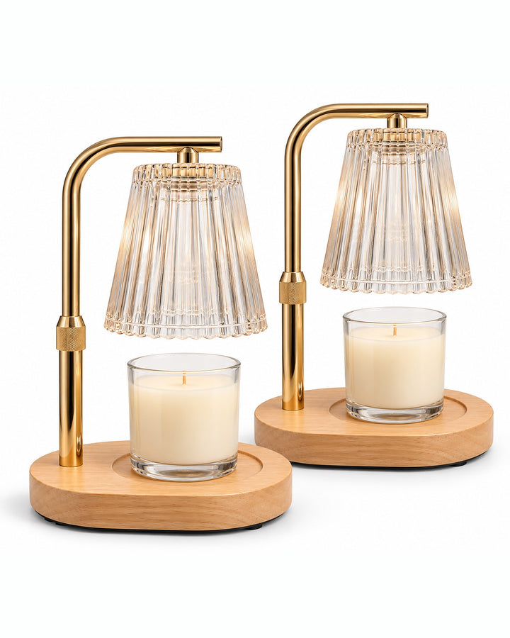 Pair of candle warmer lamps with jar candles and wooden bases on a white background