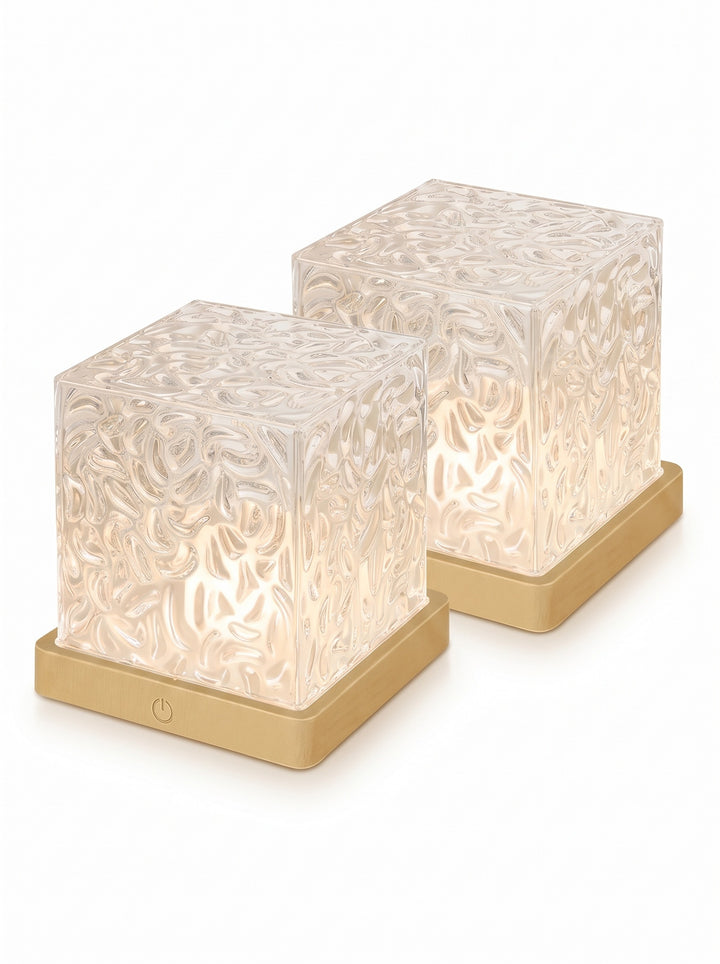 Two crystal cube lamps with faceted shades and wood-tone bases on a white background