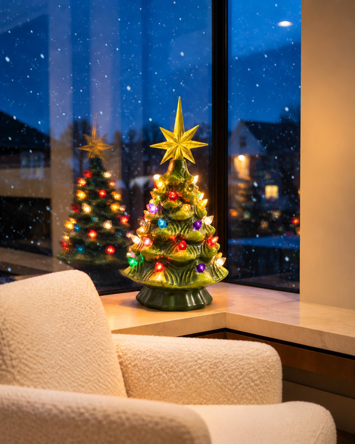Vintage-style ceramic Christmas tree glowing by a snowy window