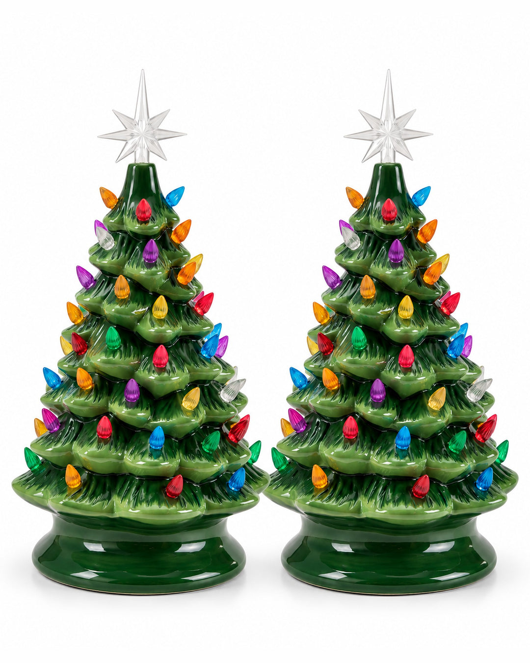 Pair of green ceramic Christmas trees with colourful bulbs and star toppers on a white background