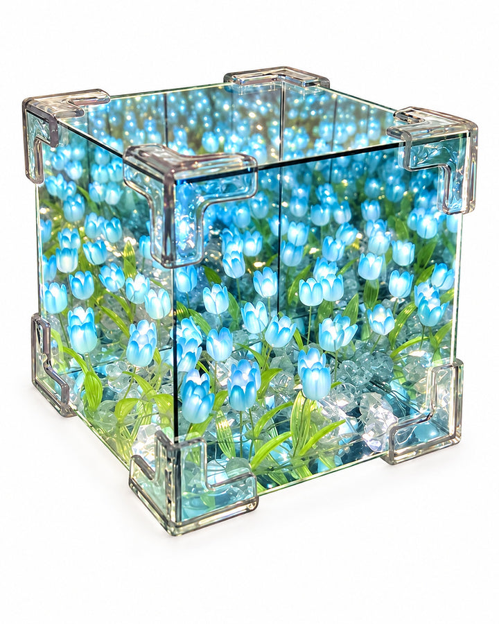 Tulip mirror cube lamp lit with blue LED tulips, three-quarter view on a white background