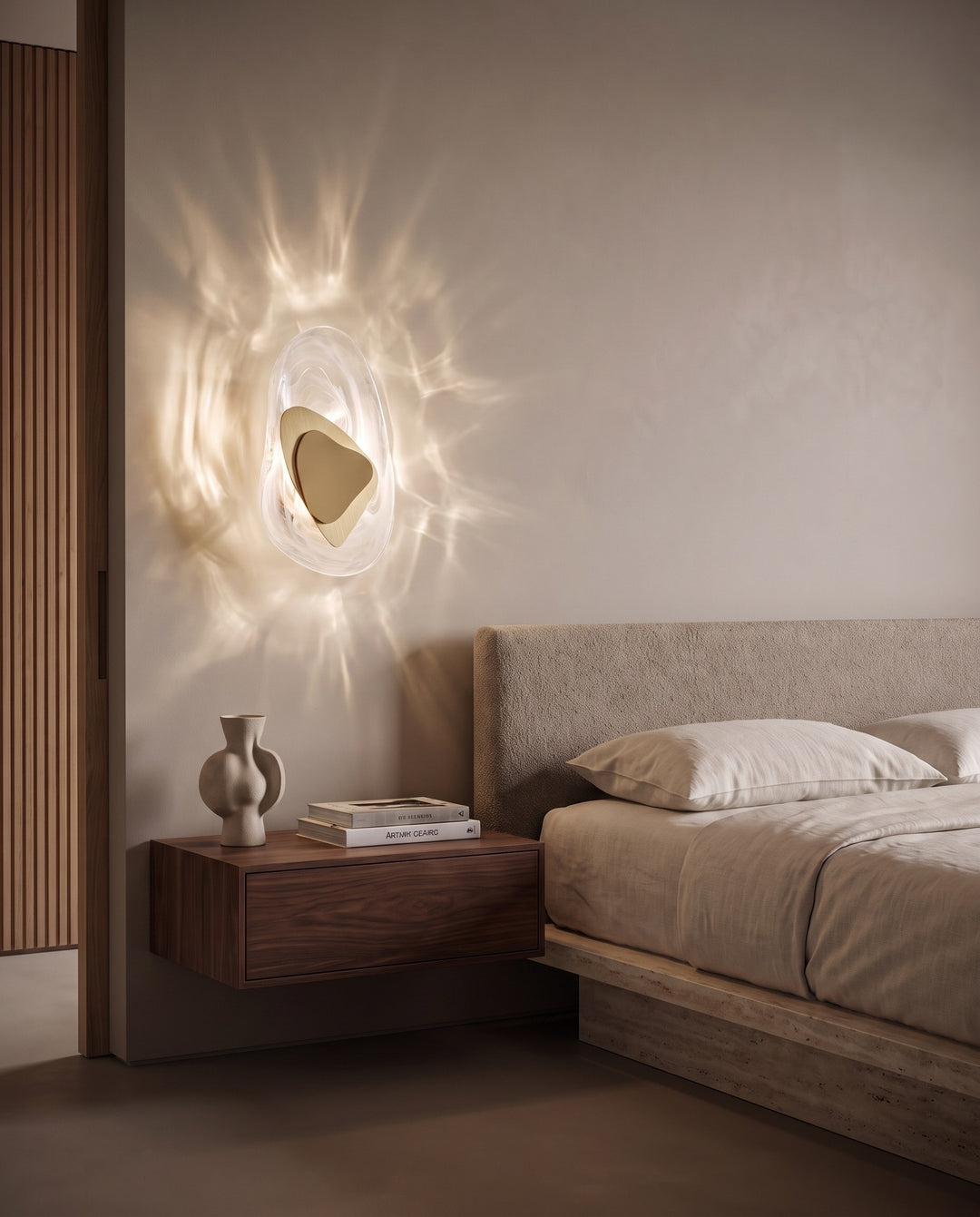 Gold Ripple glass wall light casting water-like reflections above a floating walnut bedside table