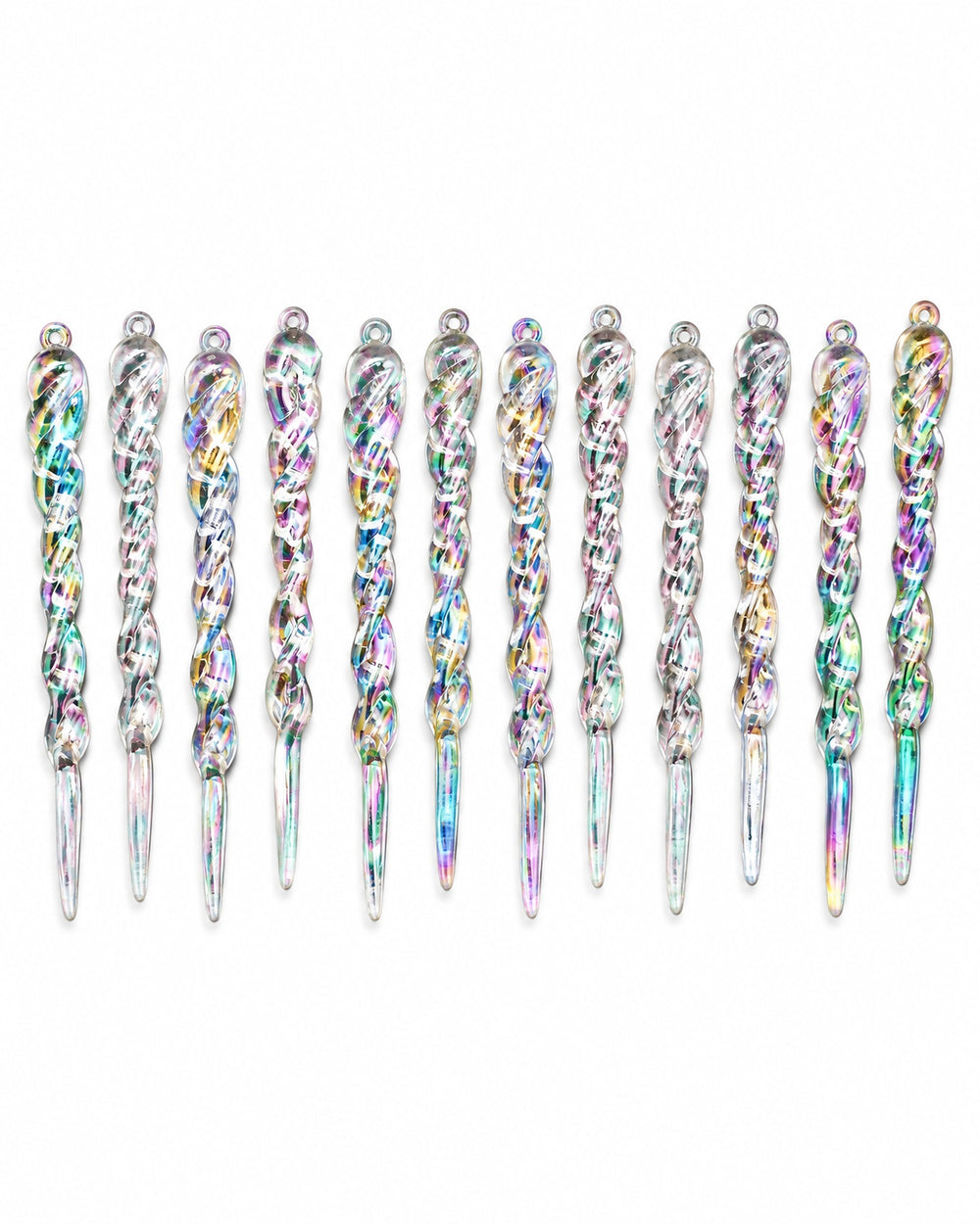 Iridescent icicle ornaments laid in a row, seen from above