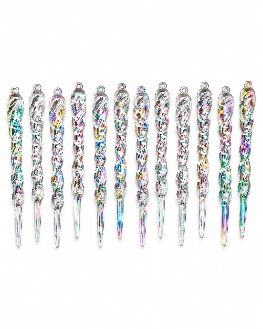 Iridescent icicle ornaments laid in a row, seen from above