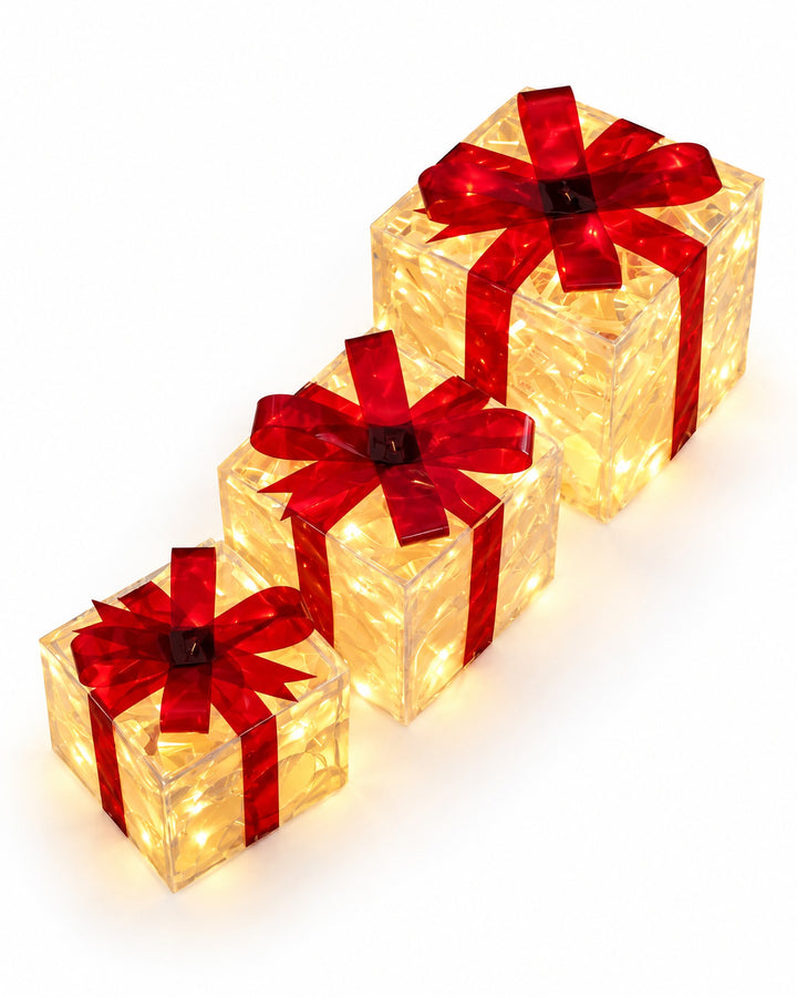 Illuminated gift boxes with red bows seen from above