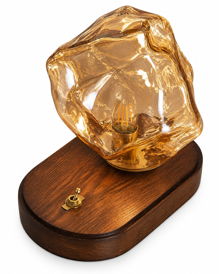 Amber ice rock glass lamp seen from above, showing the oval base and its small switch