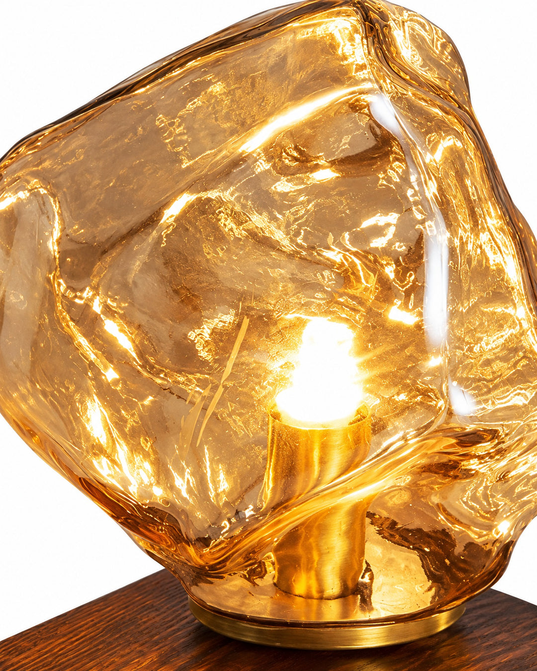 Close-up of the amber ice-block glass shade and the bulb holder