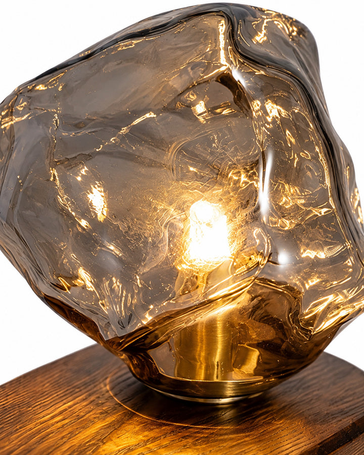 Close-up of the grey ice-block glass shade and the bulb holder