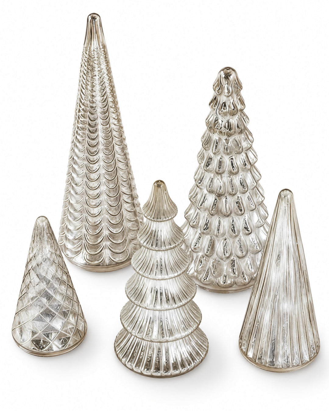 Five silver mercury glass trees seen from above on a white background