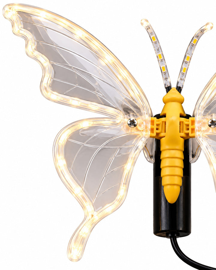 Close-up of the translucent wing and the glowing LED edge of the butterfly lamp