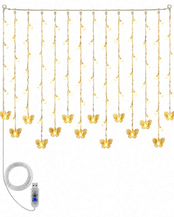 Warm white butterfly curtain lights with their USB cable, hanging on a white background