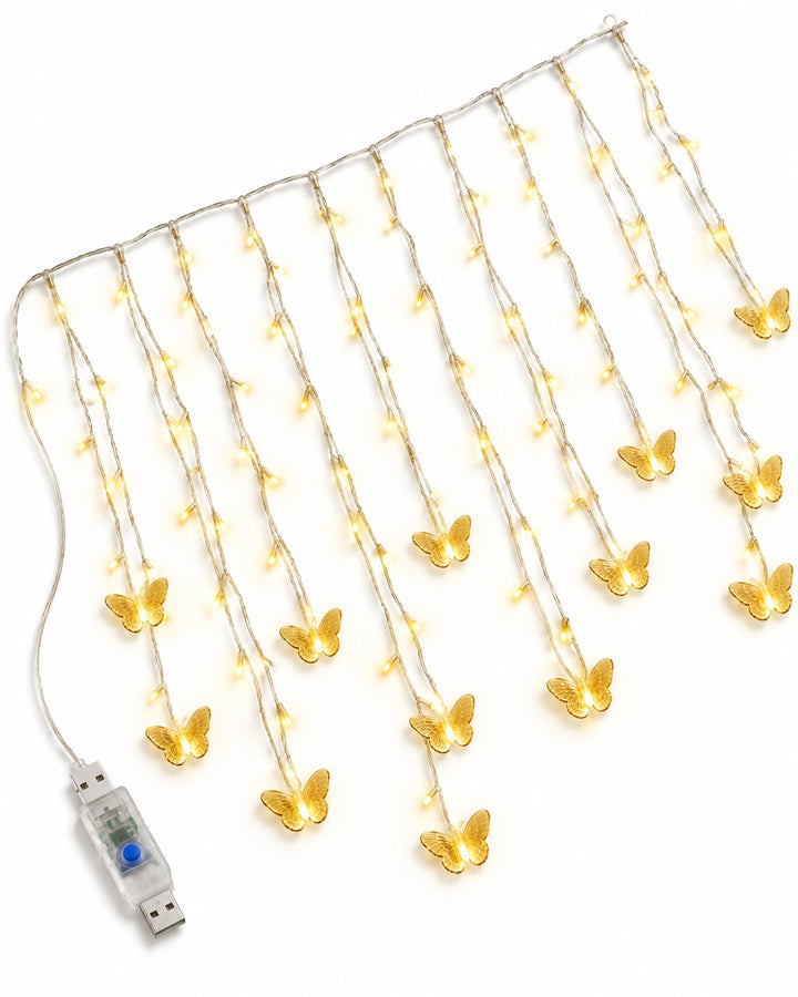 Butterfly curtain lights laid out on a white background, showing the strands, butterflies and USB plug