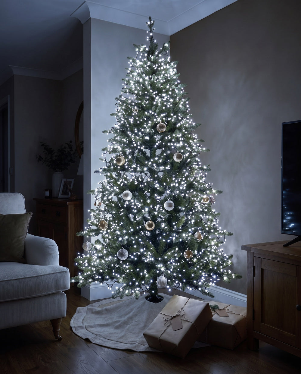 Whole Christmas tree wrapped in cool white cluster fairy lights