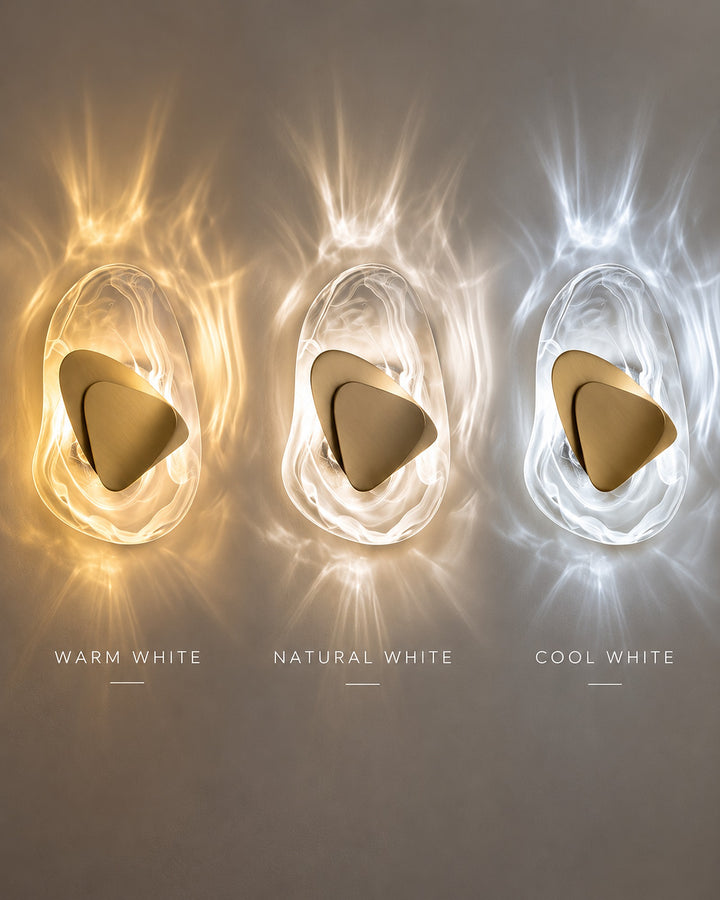 Three gold Ripple glass wall lights side by side in warm white, natural white and cool white light