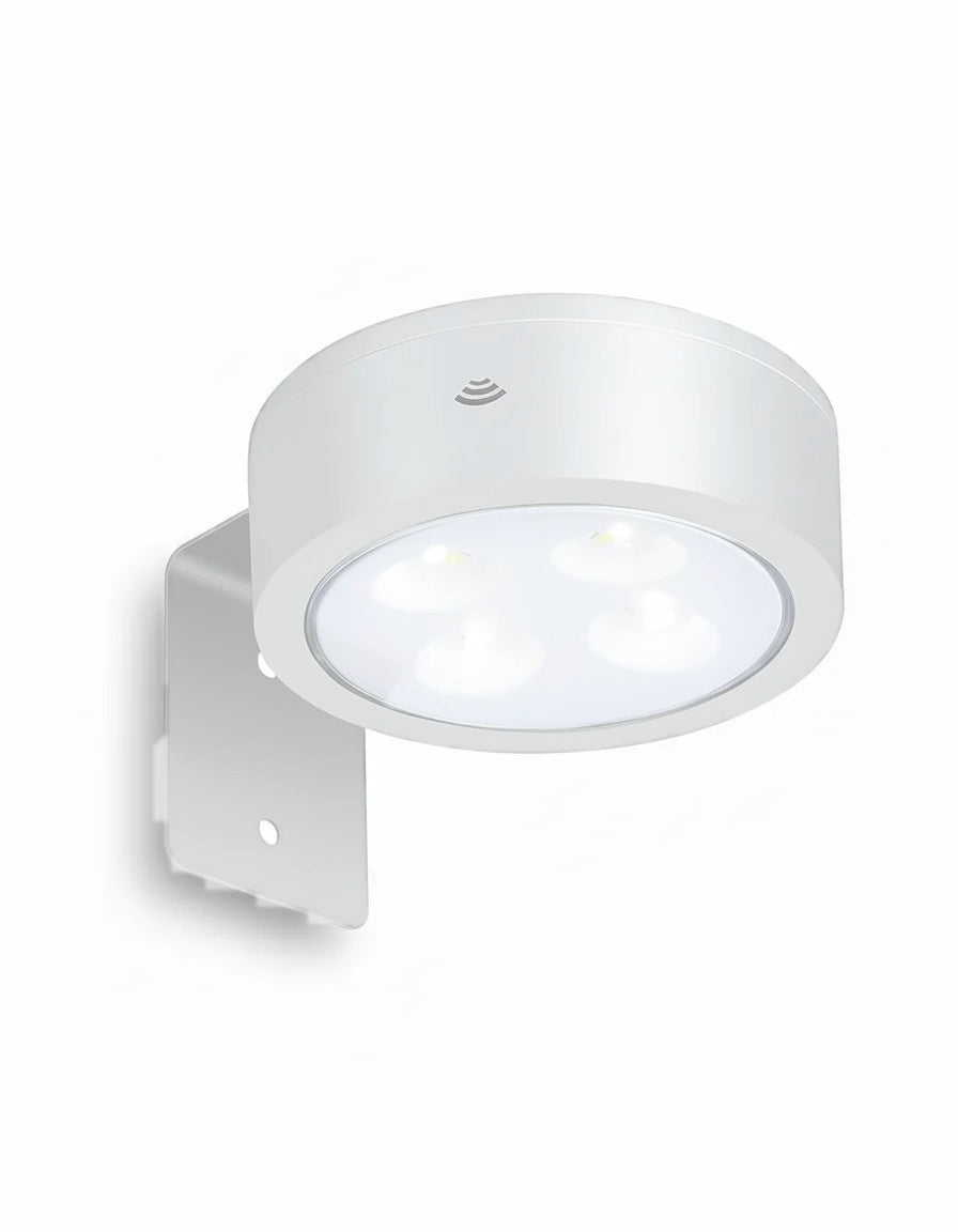 White wireless picture light with LED bulbs and wall bracket on white background