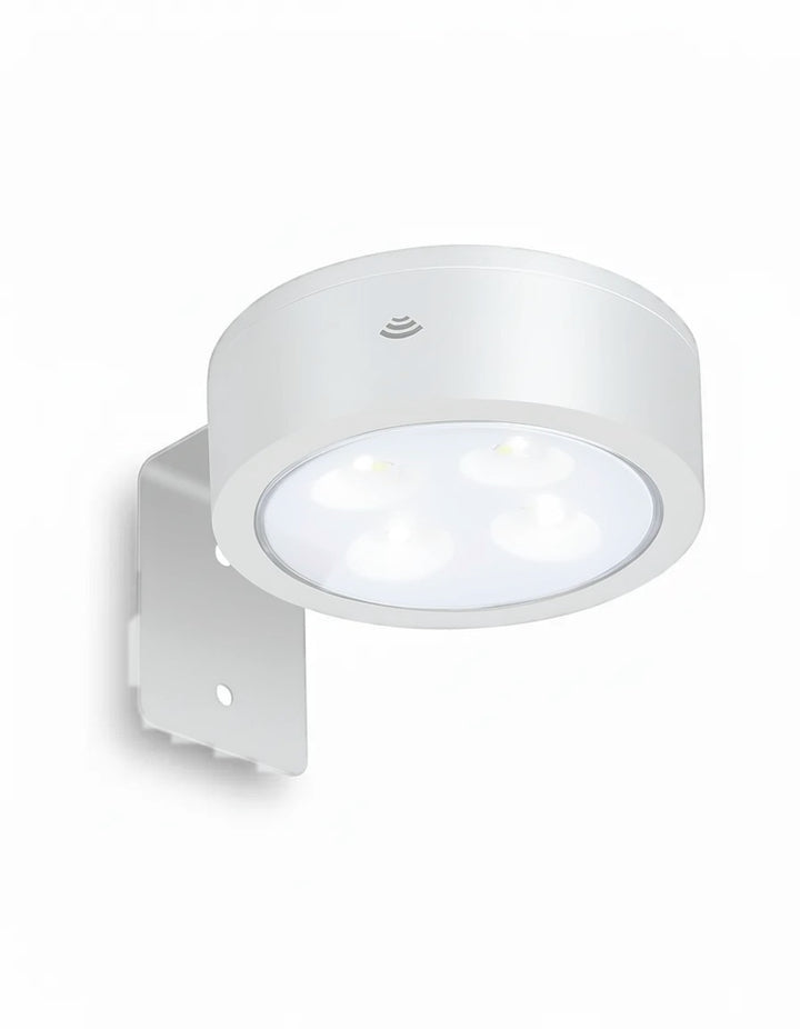 White wireless picture light with LED bulbs and wall bracket on white background